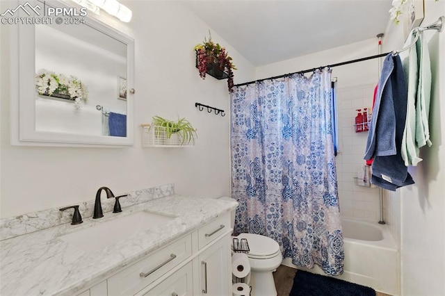 full bathroom with vanity, shower / bath combination with curtain, and toilet