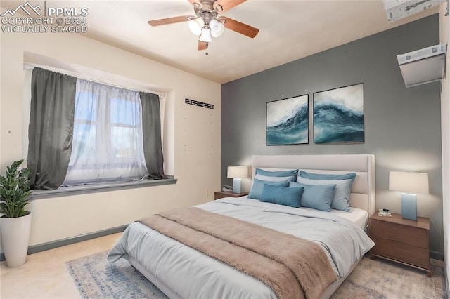 bedroom featuring ceiling fan and light colored carpet