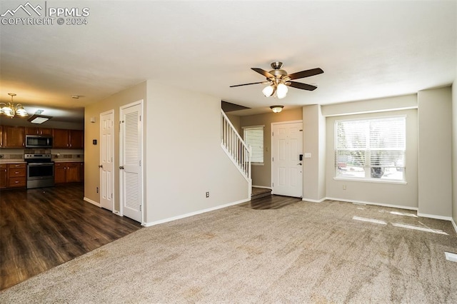 unfurnished living room with dark carpet, stairs, and baseboards