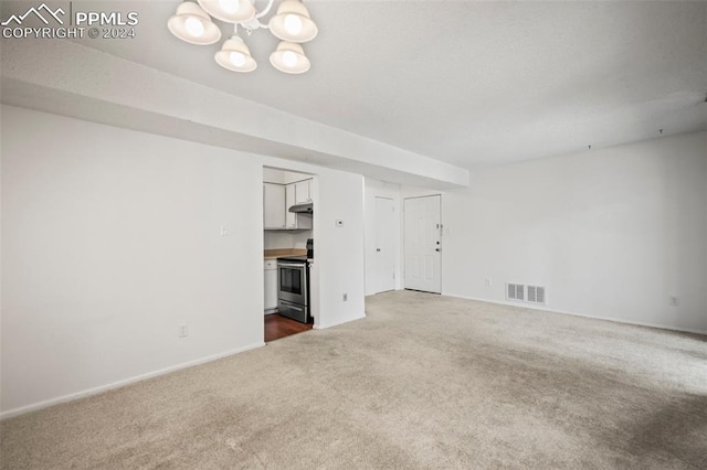 unfurnished living room featuring carpet flooring