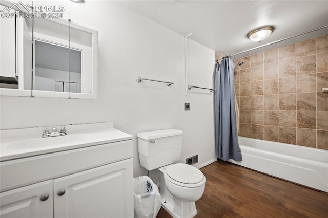 full bathroom with toilet, vanity, shower / bath combination with curtain, and hardwood / wood-style floors