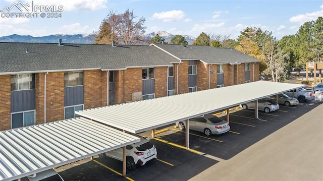 exterior space featuring a mountain view and a carport