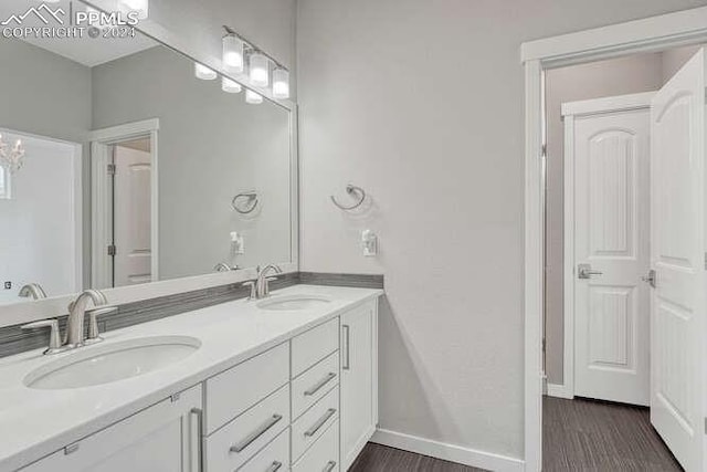 bathroom with vanity and wood-type flooring