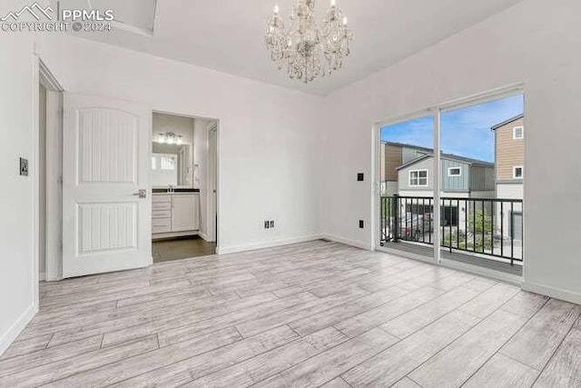 empty room featuring an inviting chandelier