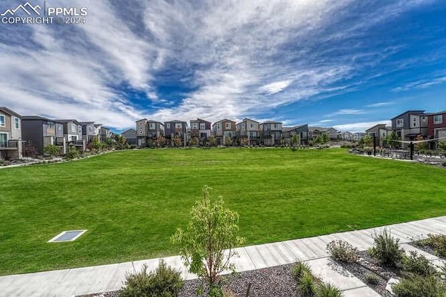 view of home's community featuring a yard