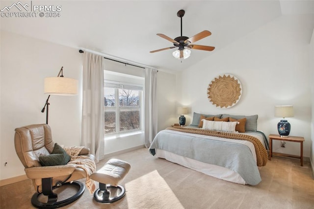 bedroom featuring ceiling fan, light colored carpet, and lofted ceiling