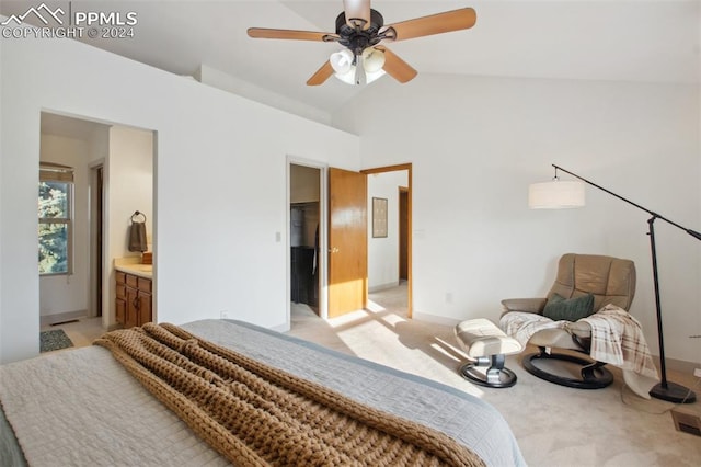 carpeted bedroom with ensuite bathroom, vaulted ceiling, and ceiling fan