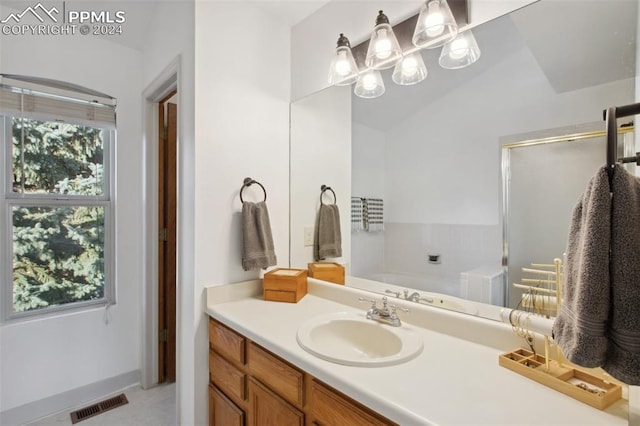 bathroom featuring tile patterned flooring, vanity, lofted ceiling, and shower with separate bathtub