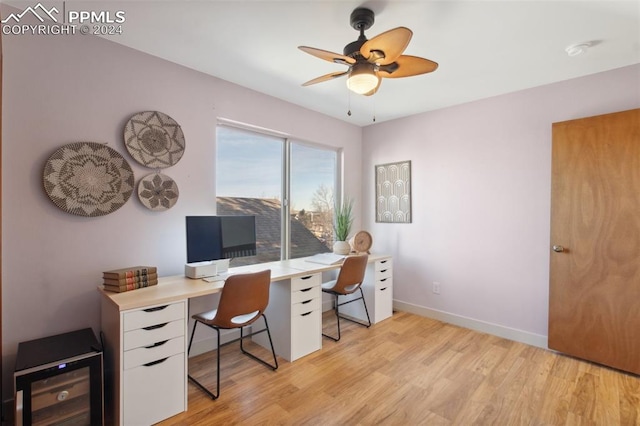 office space featuring light wood-type flooring and ceiling fan