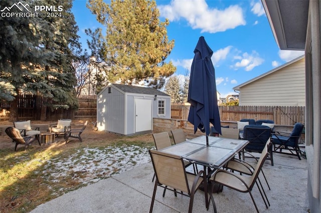 view of patio with a storage unit