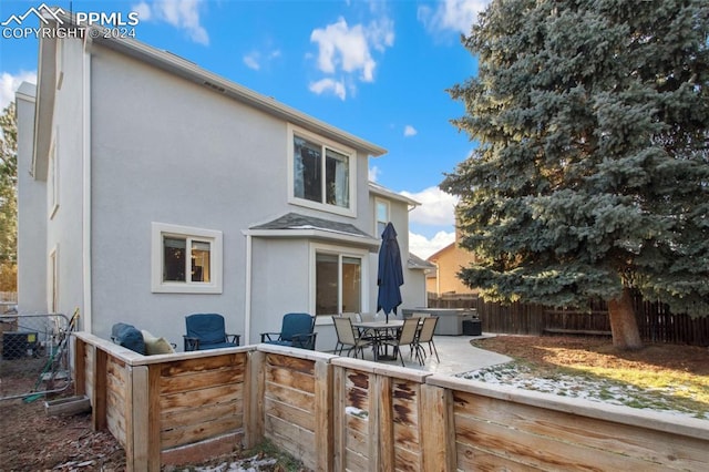 rear view of house featuring a patio