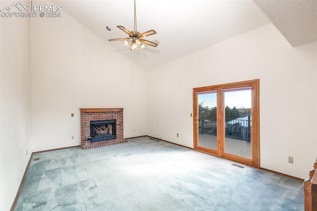 unfurnished living room with ceiling fan, high vaulted ceiling, light carpet, and a brick fireplace