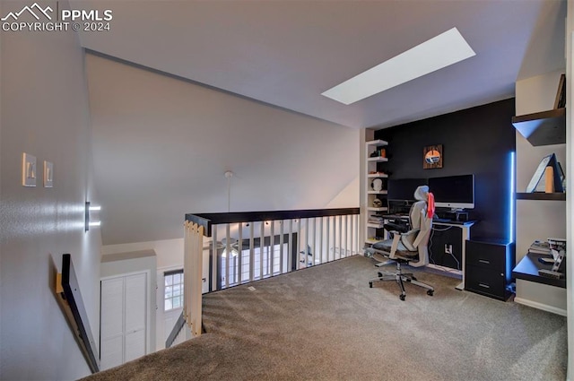 carpeted office space with a skylight