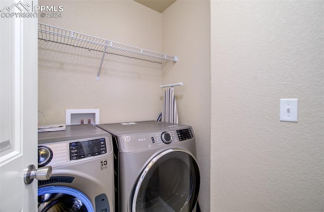 washroom with washer and clothes dryer