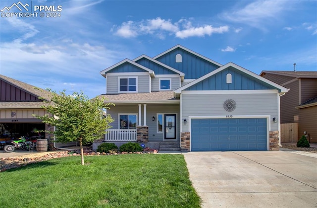 craftsman-style house featuring a porch, a garage, and a front lawn