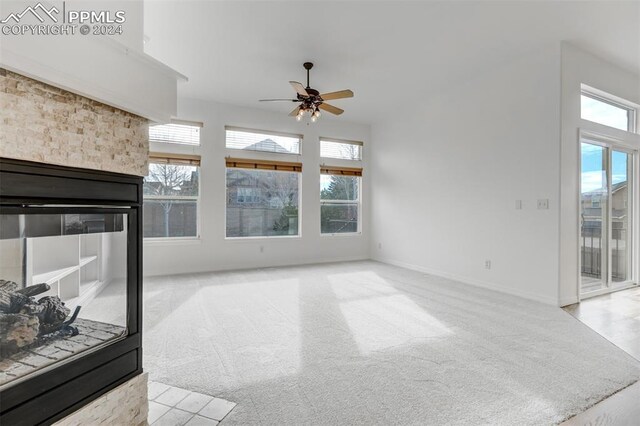 living room with ceiling fan and light colored carpet