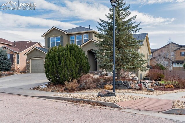 view of front of home with a garage