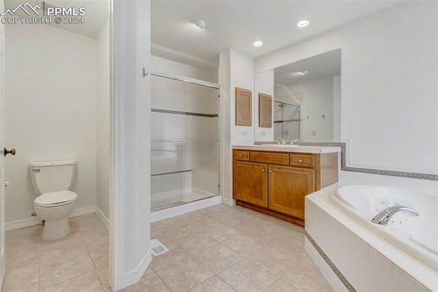 full bathroom featuring tile patterned flooring, vanity, toilet, and separate shower and tub