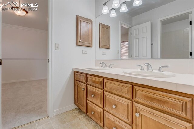 bathroom featuring vanity and crown molding