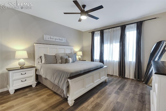 bedroom featuring dark hardwood / wood-style flooring and ceiling fan