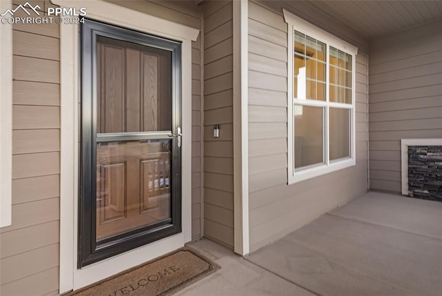 doorway to property featuring covered porch