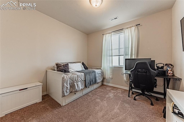 carpeted bedroom with lofted ceiling