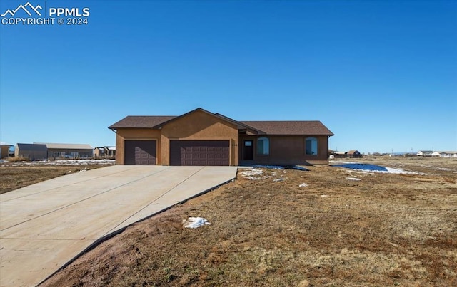 ranch-style home with a garage