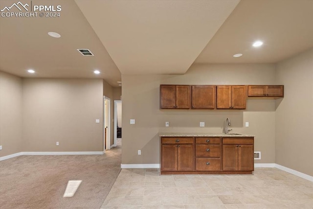 kitchen with light carpet