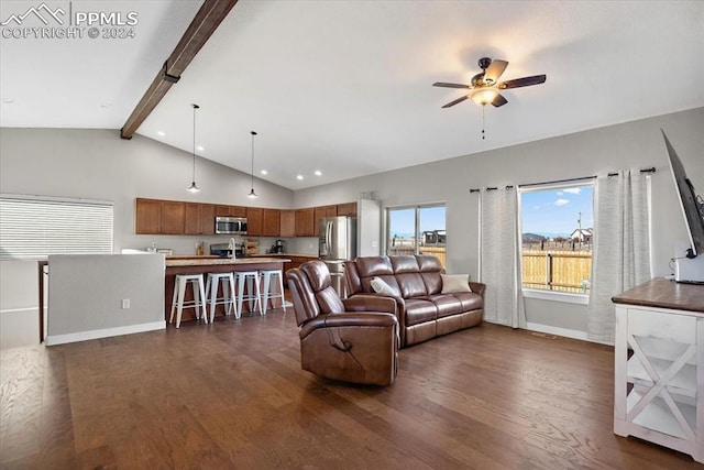 living room with lofted ceiling with beams, dark hardwood / wood-style floors, and ceiling fan