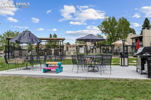 view of community featuring a patio area and a lawn