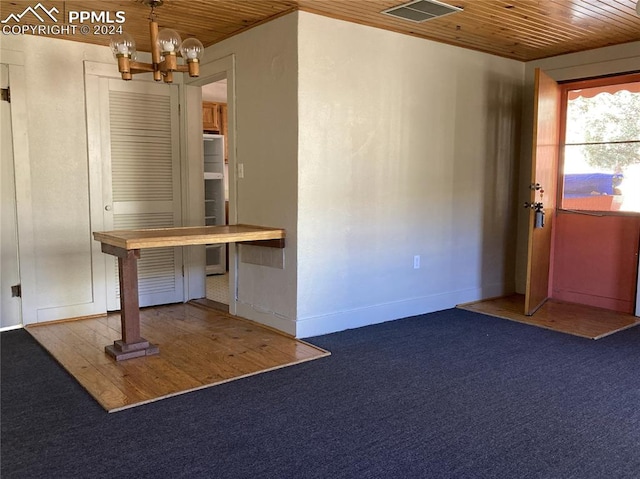 interior space featuring visible vents, baseboards, wood ceiling, and an inviting chandelier