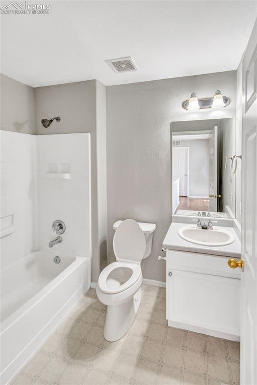 full bathroom with vanity, shower / bath combination, and toilet