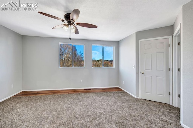 spare room with ceiling fan and carpet floors