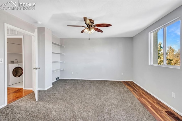 unfurnished bedroom with hardwood / wood-style floors, ceiling fan, and washer / dryer