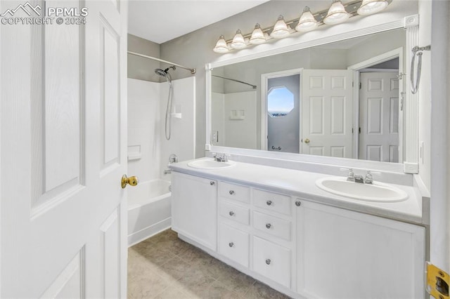 bathroom featuring bathtub / shower combination, vanity, and tile patterned flooring