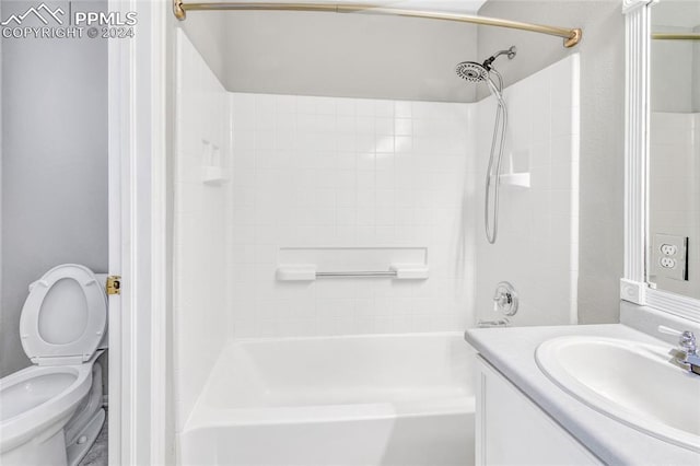 full bathroom with vanity, toilet, and tiled shower / bath