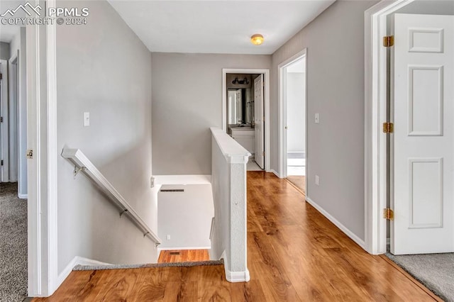 corridor featuring hardwood / wood-style floors