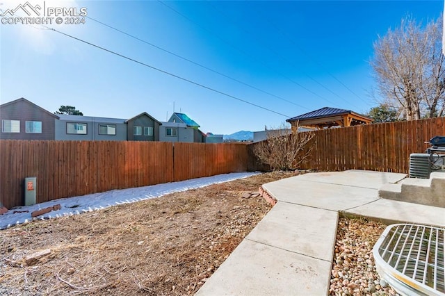 view of yard featuring a gazebo and a patio area