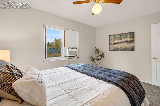 bedroom featuring carpet floors, ceiling fan, and cooling unit