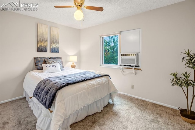 carpeted bedroom featuring ceiling fan, cooling unit, and a textured ceiling