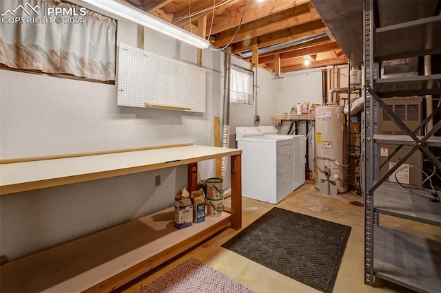 laundry room with washer and dryer and gas water heater