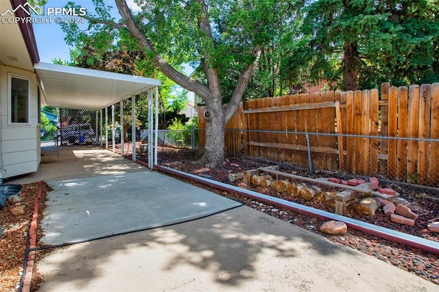 view of patio / terrace featuring a carport