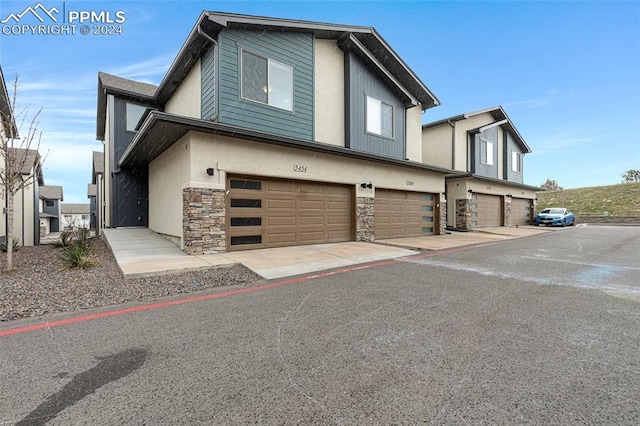 view of side of home with a garage