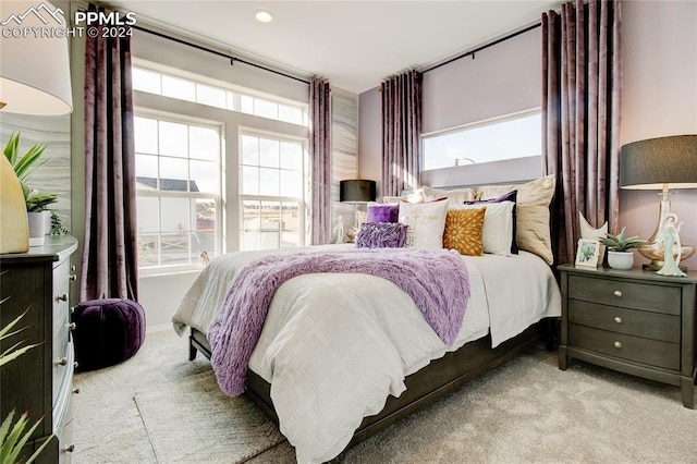 bedroom with light colored carpet