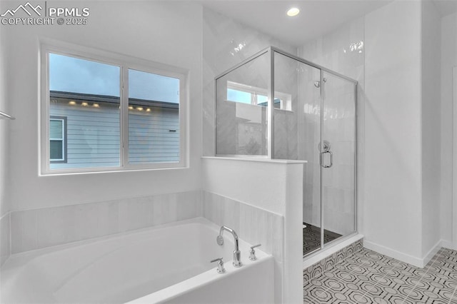 5265 Gansevoort Dr, Colorado Springs, CO 80927 - bathroom featuring a bath, a shower stall, and recessed lighting