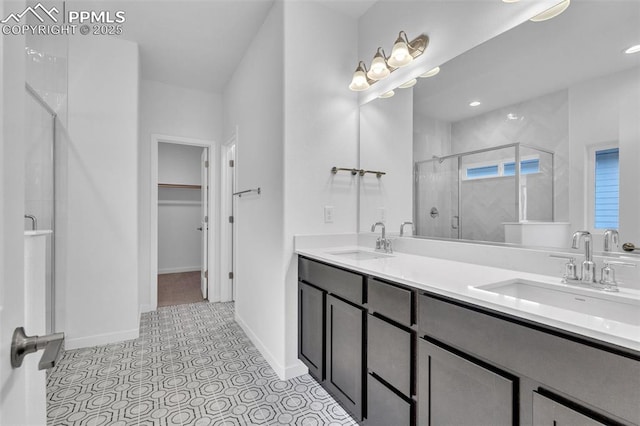 5265 Gansevoort Dr, Colorado Springs, CO 80927 - bathroom featuring a shower stall, double vanity, and a spacious closet