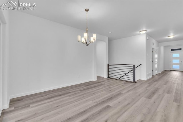 5265 Gansevoort Dr, Colorado Springs, CO 80927 - spare room featuring a chandelier and wood finished floors