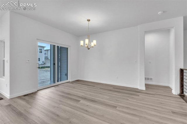 5265 Gansevoort Dr, Colorado Springs, CO 80927 - unfurnished room featuring light wood-style floors and a chandelier