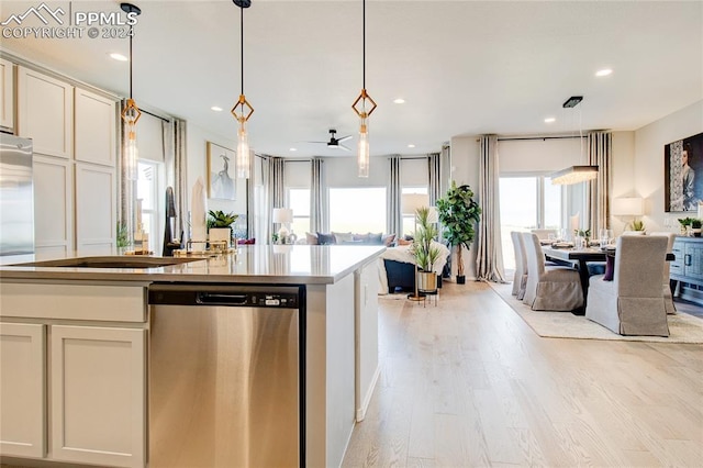 kitchen with dishwasher, light wood-type flooring, hanging light fixtures, and ceiling fan