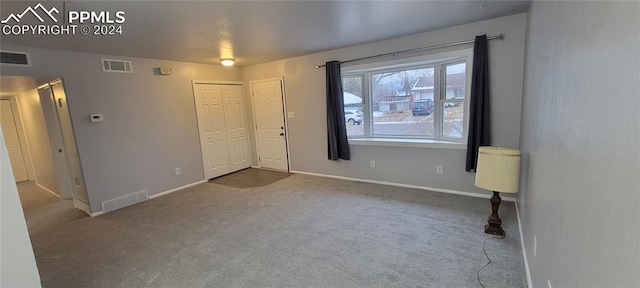 unfurnished bedroom with carpet floors